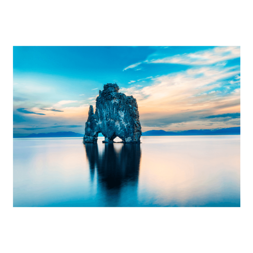 Dramatic Icelandic sky — layers of cloud and light above an open volcanic landscape
