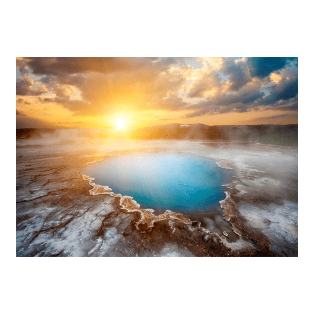 Iceland midnight sun — golden light from the Arctic summer solstice casting long shadows across an open landscape